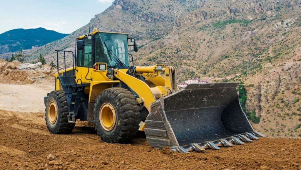 Wheel loader moving gravel